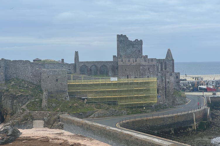 Visitors to St Patrick’s Isle can currently see scaffolding wrapped in yellow mesh along the curtain wall of Peel Castle (Photo - Tom Curphey)