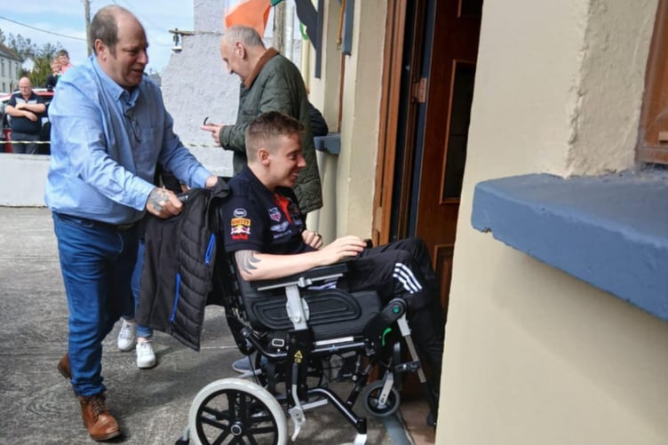 Anthony O'Carroll is wheeled through the door of the family home in County Kerry