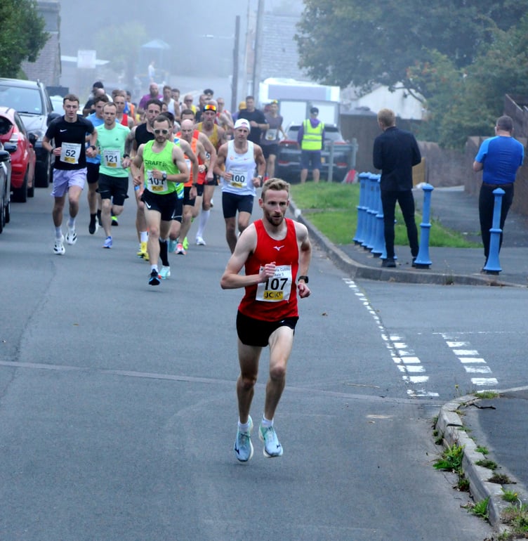Ollie Lockley leading the field away in the early stages as the race set off from a point close to Foxdale School (Photo: John Watterson)