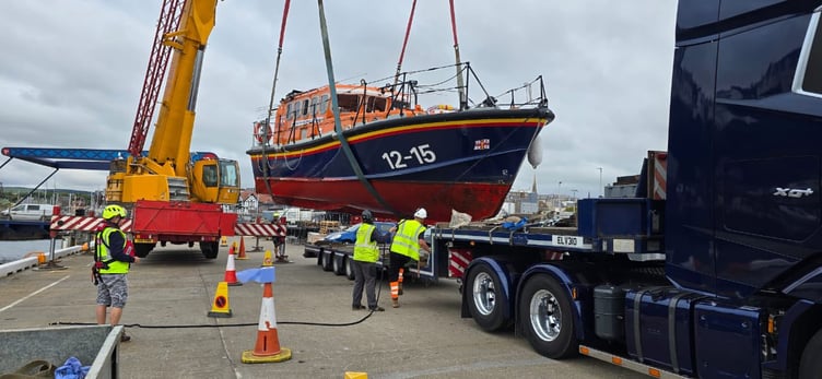 Douglas RNLI's old Mersey class boat is craned onto a trailer ahead of its well-earned retirement