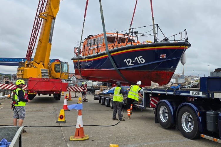 Douglas RNLI's old Mersey class boat is craned onto a trailer ahead of its well-earned retirement