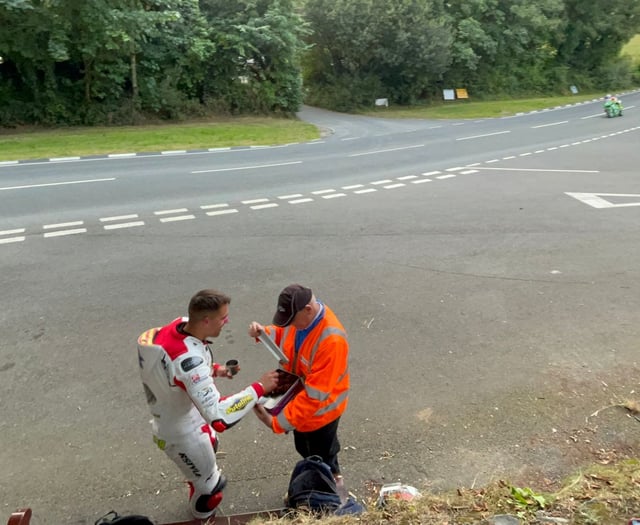 Classic TT competitor served refreshments from Lieutenant Governor 