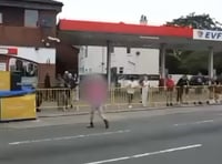 Spectator filmed crossing closed course seconds before bike races past