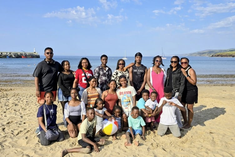 The ‘Umu-Love' family from Nigeria enjoying the sun at Port Erin beach