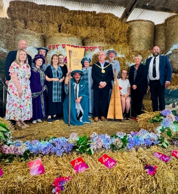 New Manx Bard Bradley Chambers celebrates his inauguration during an event in Colby