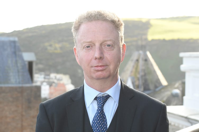Treasury Minister Dr Alex Allinson 