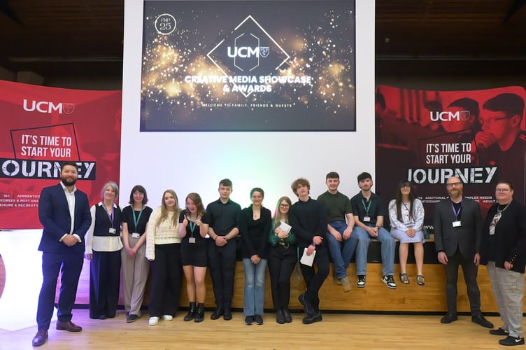 Ewan MacFarlane and Sonya Quayle (both far left) from UCM said they were 'extremely proud' of all their students