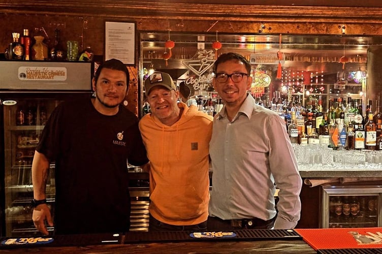 Eastenders' star Jake Wood pictured behind the bar at the Majestic Chinese on Douglas Promenade