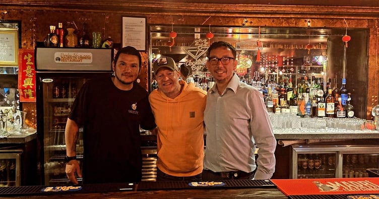 Eastenders' star Jake Wood pictured behind the bar at the Majestic Chinese on Douglas Promenade