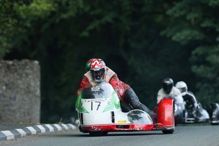 Keith Walters and Allyn Thomas onboard a 1972 - 750 Honda through Greeba Castle during Wednesday evening's parade lap (Photo: Callum Staley/CJS Photography)