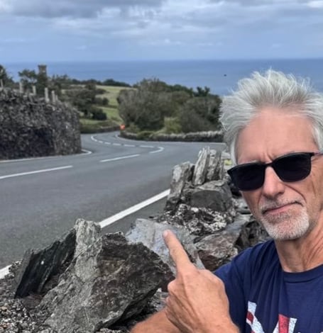 Former Formula One World Champion Damon Hill waiting for a Manx Grand Prix bike on the exit of Ramsey