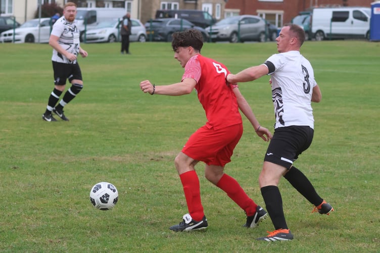 Governor's Athletic's Santiago Caixeiro battles for the ball with Colby's Jonathan Croft in Tuesday night's clash at Springfield Road (Photo: Paul Hatton)