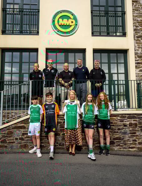 Junior coaches and players from Laxey FC with representatives from MMD and Lesley Turnbull MBE of charity Wish Upon a Dream
