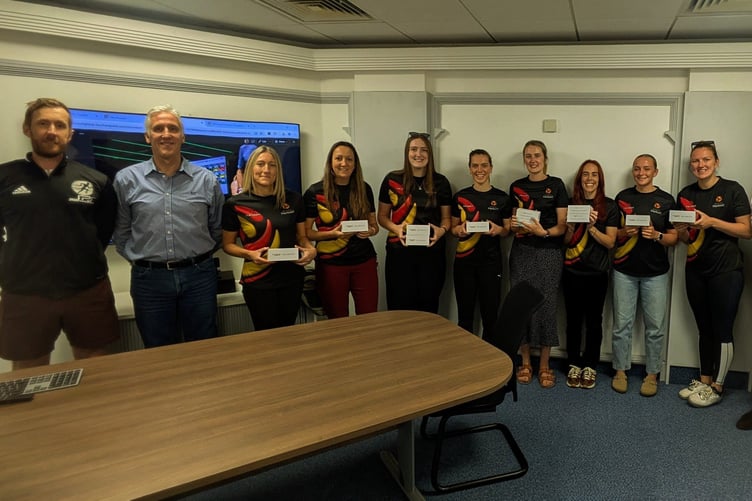 The Isle of Man netball squad receives their heart-rate monitors from Myzone Holdings Limited