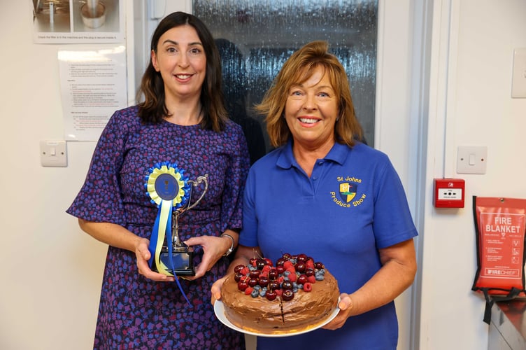 Kate Lord Brennan MHK won the John Quayle Memorial Cup for Best Chocolate Cake, pictured with St John's Produce Show organiser Sue Staley