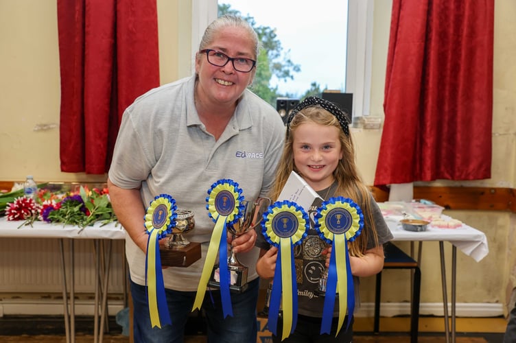 Amelia Kneen, winner of the John Kinrade Memorial Cup for most entries in children’s confectionery, with Shirley Cain from Ed Space