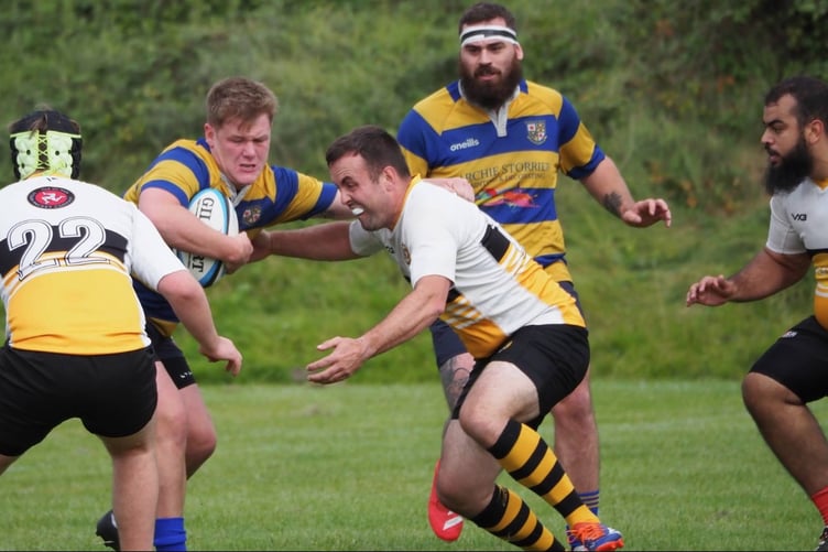 Vagabonds' captain Don Bonwick shapes up to tackle a Burnley opponent during Saturday's match at Holden Road (Photo: Burnley RUFC)