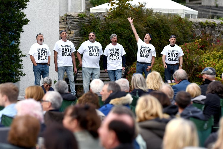 Participants in the show wear t-shirts reading 'Sharon Says Relax'