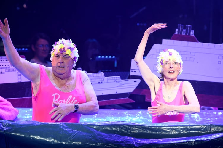 Geoff and Dot performing an open water swimming scene in Manannan's Winterfest in front of a sold out Gaiety Theatre back in 2023