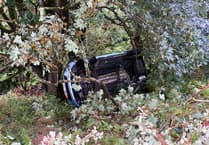 Pictures show just how far car has dropped into embankment after crash off coast road