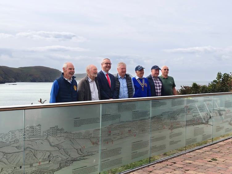 Members of the Rotary Club of Rushen and Western Mann with Speaker of the House of Keys Juan Watterson with the new panels