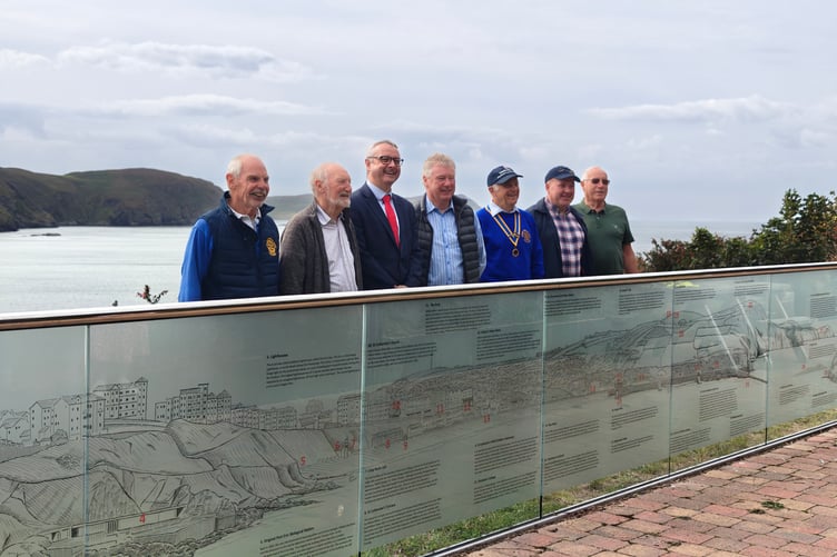 Members of the Rotary Club of Rushen and Western Mann with Speaker of the House of Keys Juan Watterson with the new panels