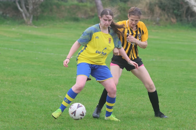 Onchan's Chloe Kneale (left) and Rushen United's Ann-Marie Crompton in action at Croit Lowey on Sunday (Photo: Paul Hatton)