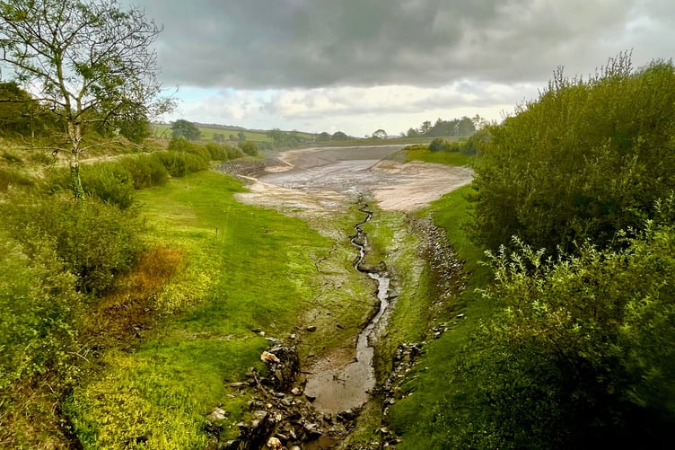 A trickle of water enters the now empty Clypse Reservoir