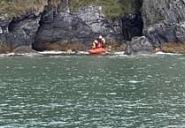 Lifeboat crews rescue injured casualty cut off from the tide near Ramsey