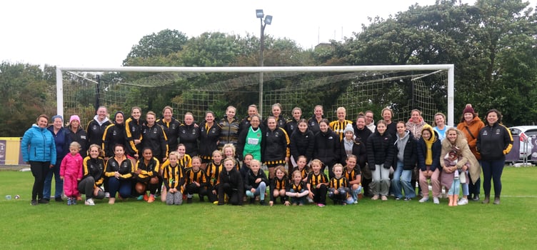 Rushen United's women's team pictured with some of the club's former and junior players plus supporters ahead of their match against Onchan last weekend which marked their return to the Canada Life Women's League (Photo: Paul Hatton)