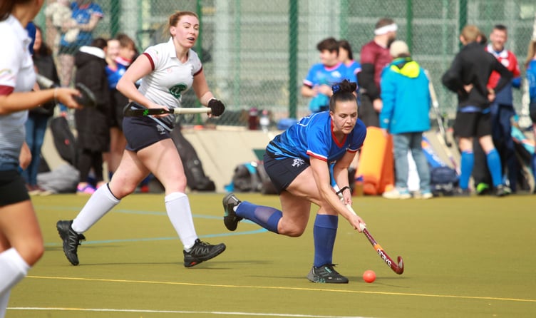 Valkyrs A's Maxine Jones dribbles the ball downfield under pressure from Bacchas B's Georgia Sullivan during last weekend's Mixed Premier League clash at QEII (Photo: Dave Norton)