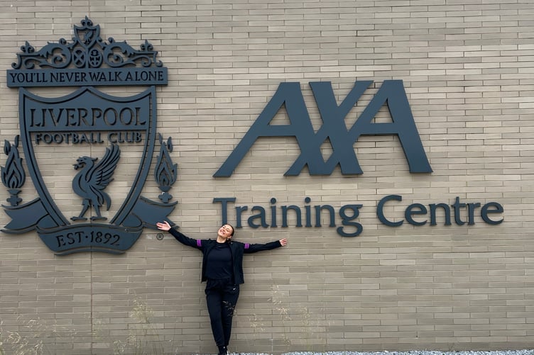 Alex pictured at the Liverpool Football Club Training Centre, where she worked as a physiotherapist.