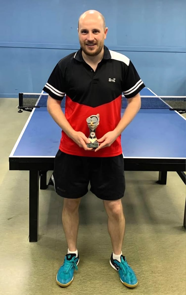 Newly-crowned 2025 English Open Hard Bat champion Scott Lewis with his trophy (Photo: Malc Lewis)