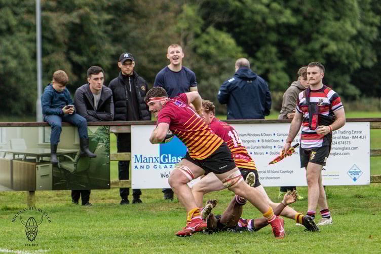 Man of the Match Harry Cartwright on his way to scoring for Douglas on Saturday (Photo: Richard Ebbutt)
