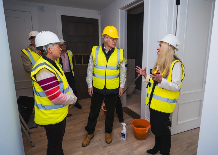 The Lieutenant Governor Sir John Lorimer and Lady Lorimer talking to Julie Jones, Hartford Homes’ sales and lettings manager