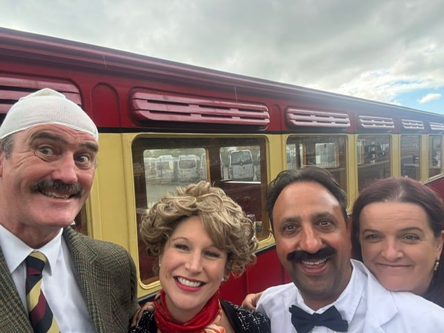 The Fawlty Towers cast with hospitality and events executive officer for Isle of Man Transport Charlotte Watterson (right)