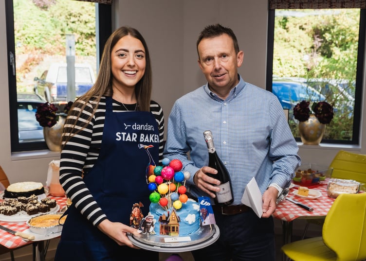 Dandara's Alex Corrin receives a prize from managing director Austin McGuire