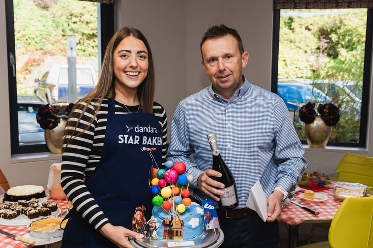 Dandara's Alex Corrin receives a prize from managing director Austin McGuire