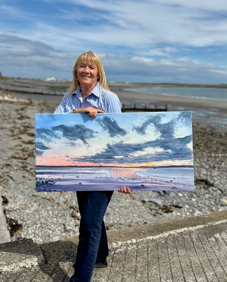 Chrissie Moss with one of her pieces of artwork