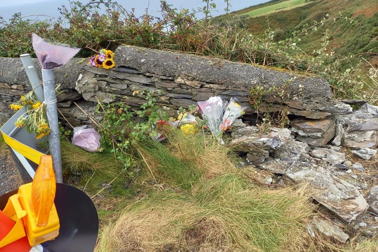 Flowers laid at Devil's Elbow, between Peel and Kirk Michael, where Kian Broadhead died following a crash