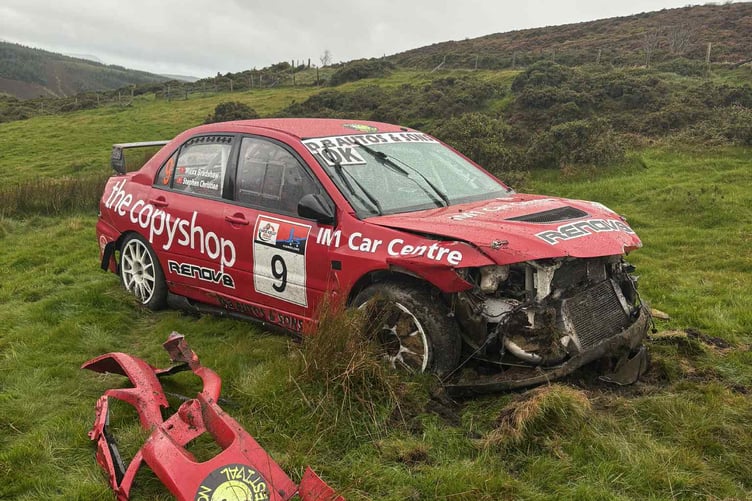 The rally car pictured in a field following the 100mph crash, with both driver and co-driver escaping with just 'a few bruises'