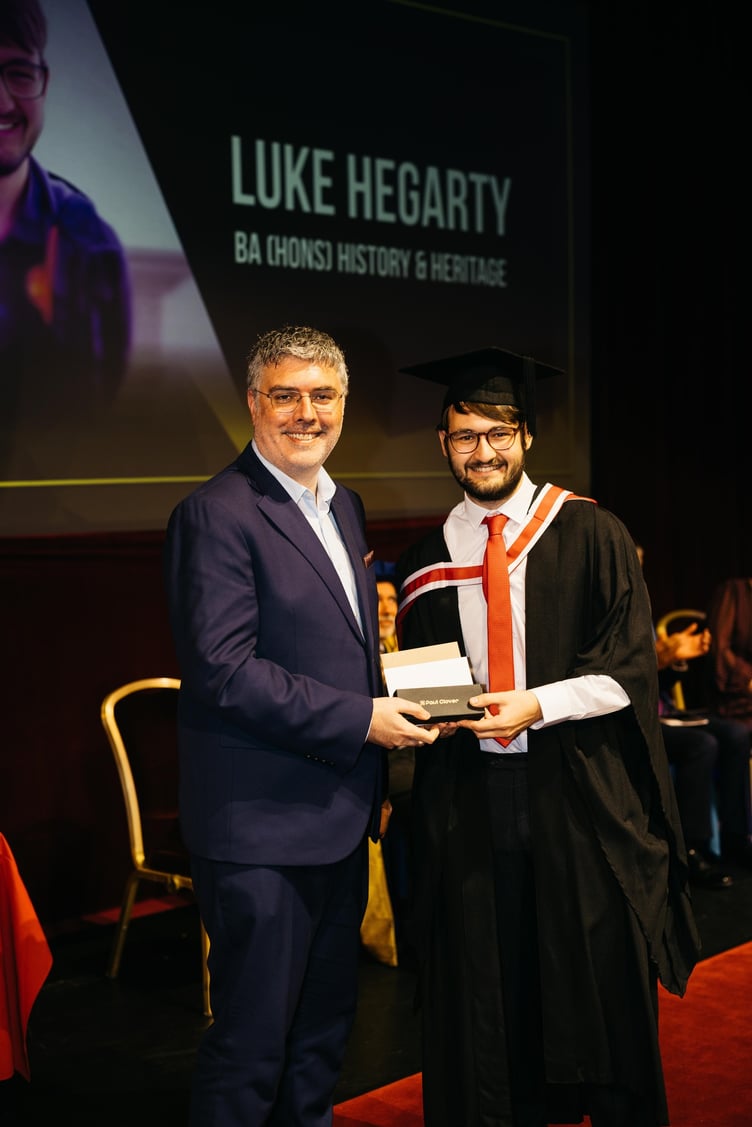 Ben Callow from Utmost International presenting the Research Award to Luke Hegarty