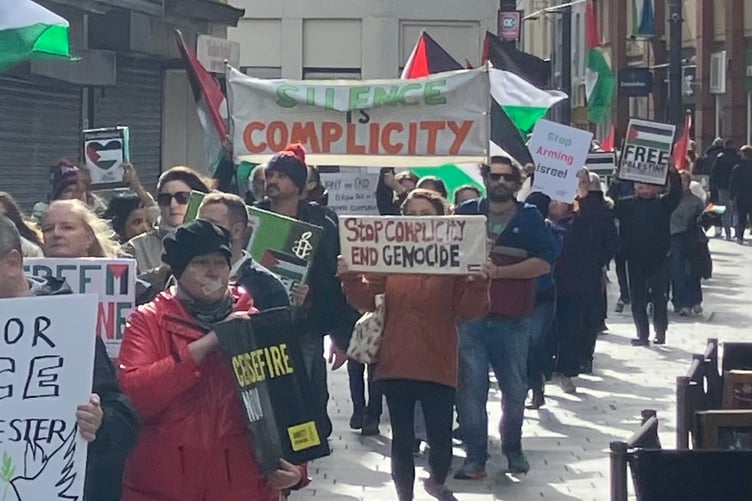 Protestors march through Strand Street in Douglas against Israel's military offensive in Gaza