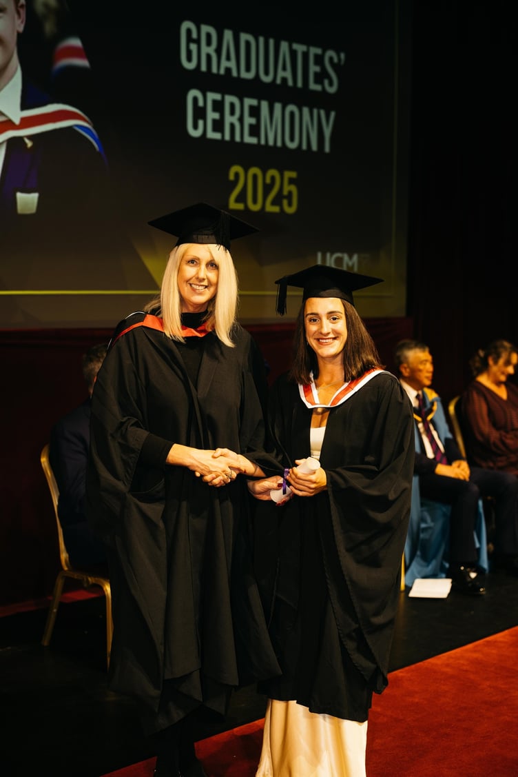 Teresa Cope, chief operating officer at Manx Care presenting a scroll to Charlotte Clancey