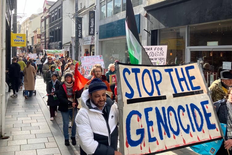 Protestors march through Strand Street in Douglas against Israel's military offensive in Gaza