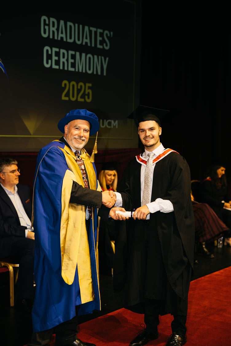 Professor Paul Johnson presenting a scroll to Finloe Gelling