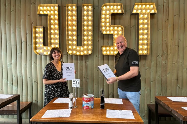 Natasha Molyneux-Smith with Mitch Sorbie and the new Braille menus.