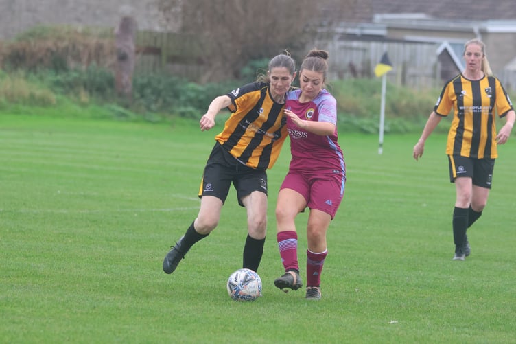 Rushen United's Anne-Marie Crompton and Union Mills' Ava Pearson (right) jostle for the ball during Sunday's clash at Croit Lowey (Photo: Paul Hatton)