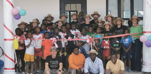Staff make final visit to orphanage secured through firm's fundraising