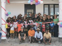 Staff make final visit to orphanage secured through firm's fundraising